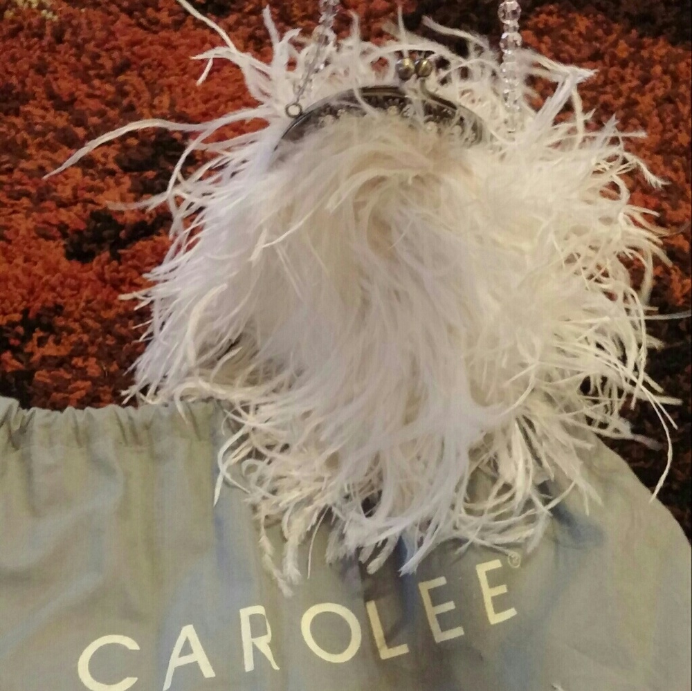 Carolee white feather purse never used